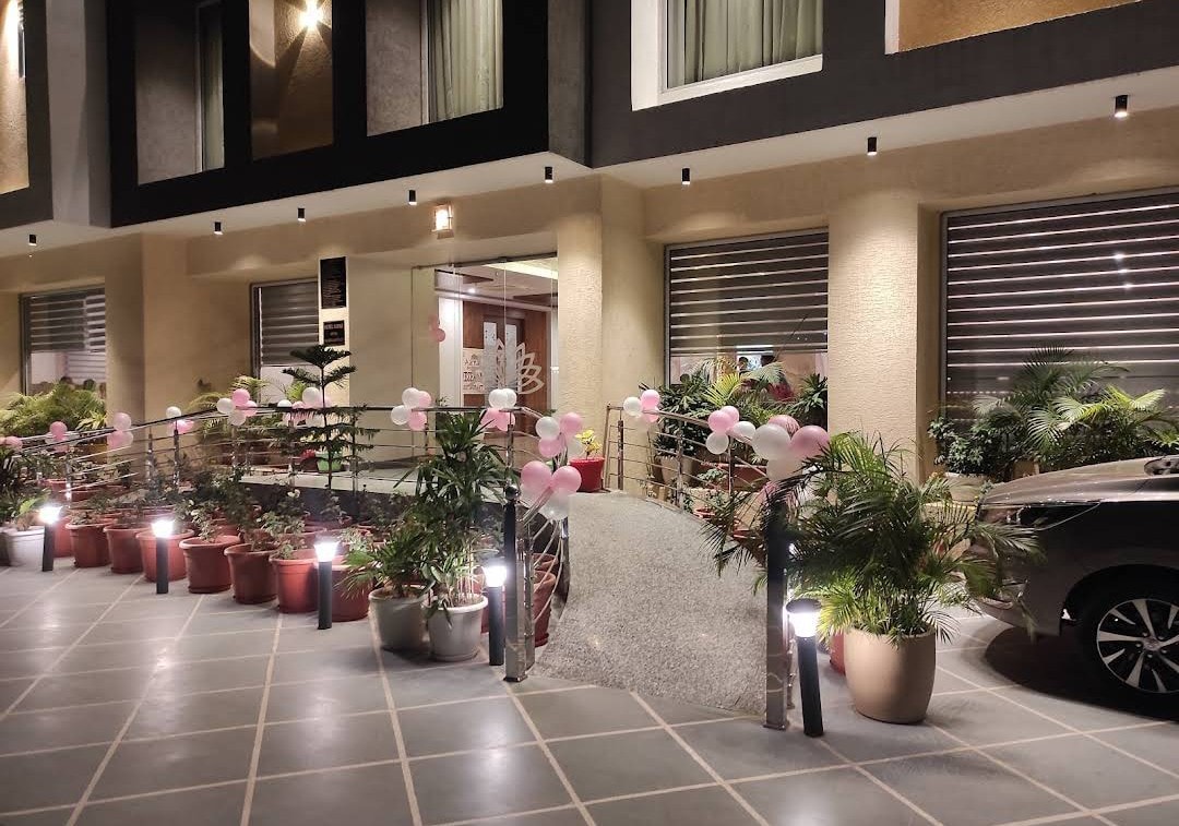 Hotel Aarna Premier entrance decorated with lanterns and flowers for a celebration in Jaipur