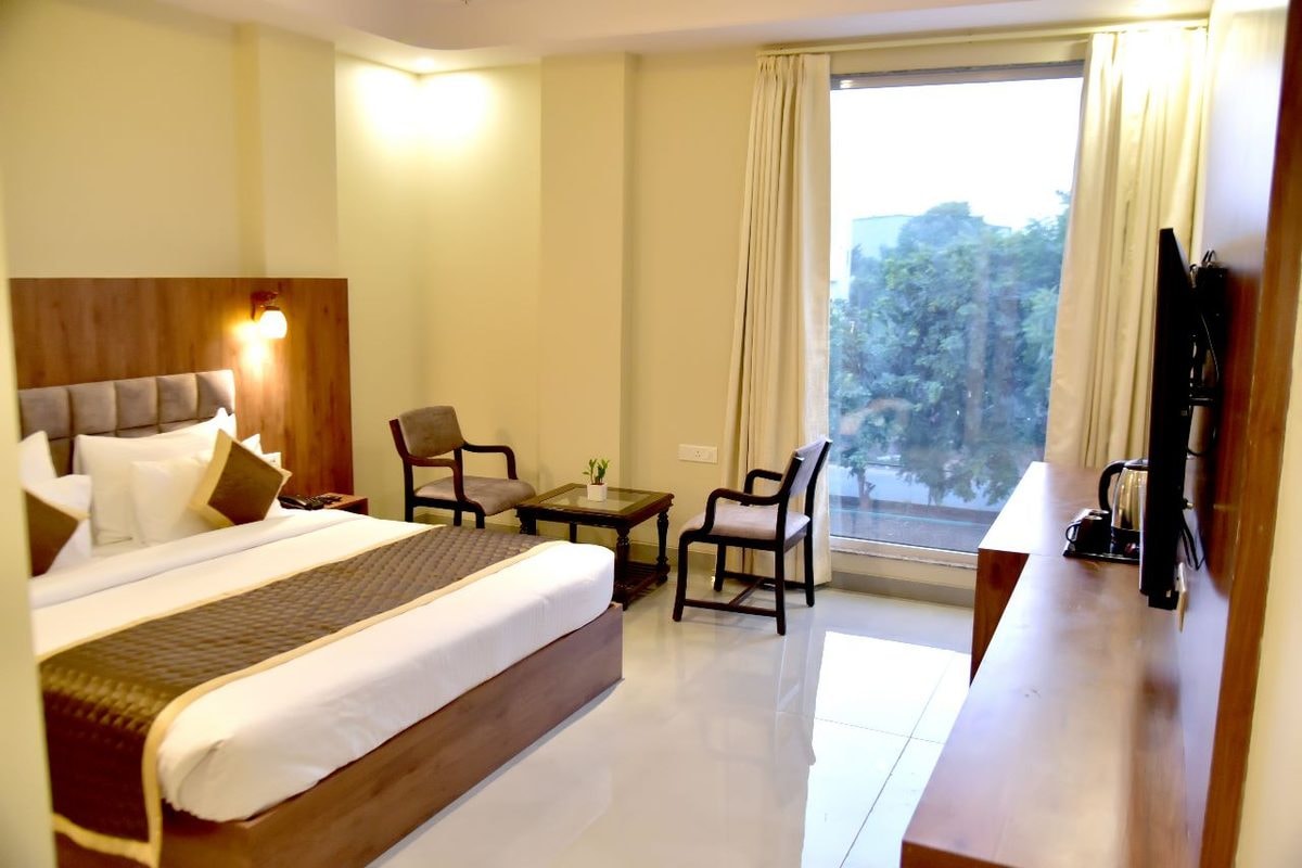 A forest view from a room window at Hotel Aarna Premier, Jaipur