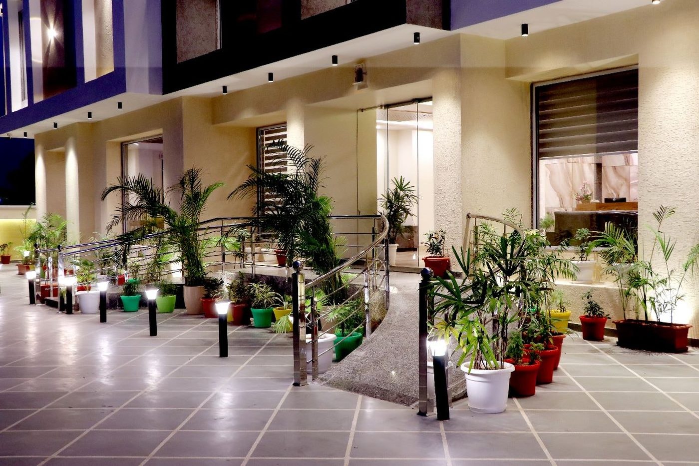 Open-air terrace seating at Hotel Aarna Premier, Jaipur