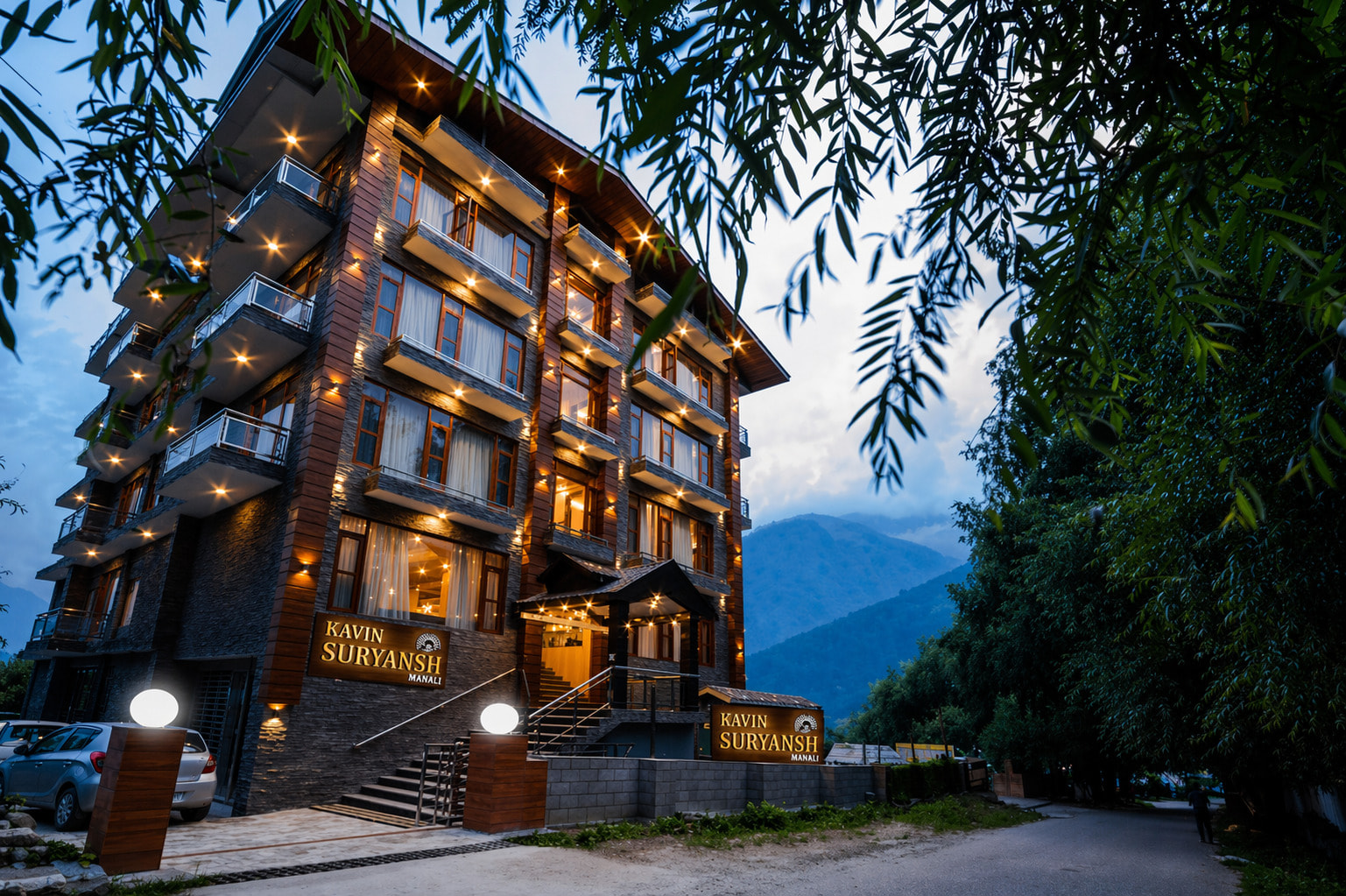 Evening facade of Hotel Suryansh Regency, Aleo Manali