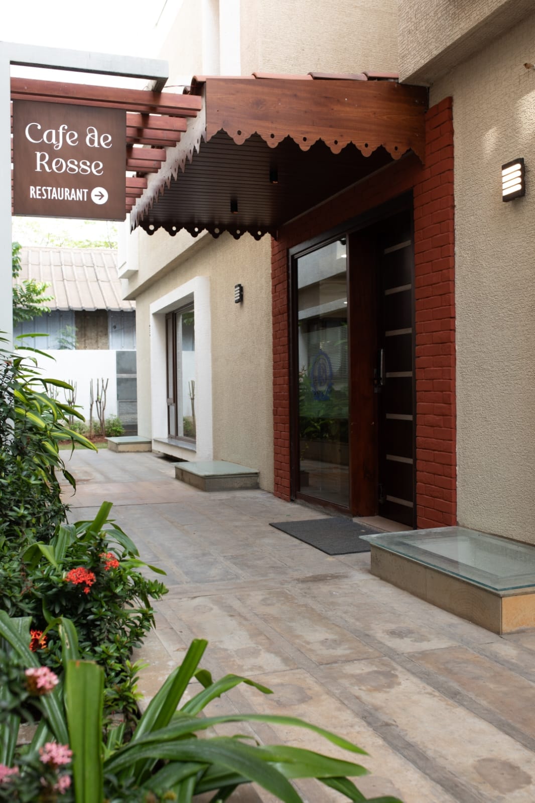 The Café de Rosse restaurant entrance and signage at Rossedale Suites & Hotel in Peelamedu, Coimbatore