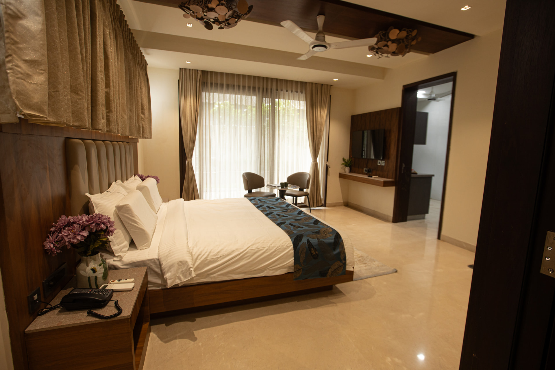 The Executive Kitchenette bedroom with a king-size bed at Rossedale Suites & Hotel in Peelamedu, Coimbatore