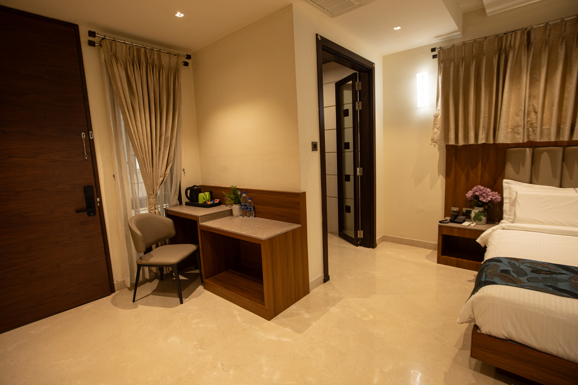 A work desk and chair in the Executive Kitchenette at Rossedale Suites & Hotel in Peelamedu, Coimbatore
