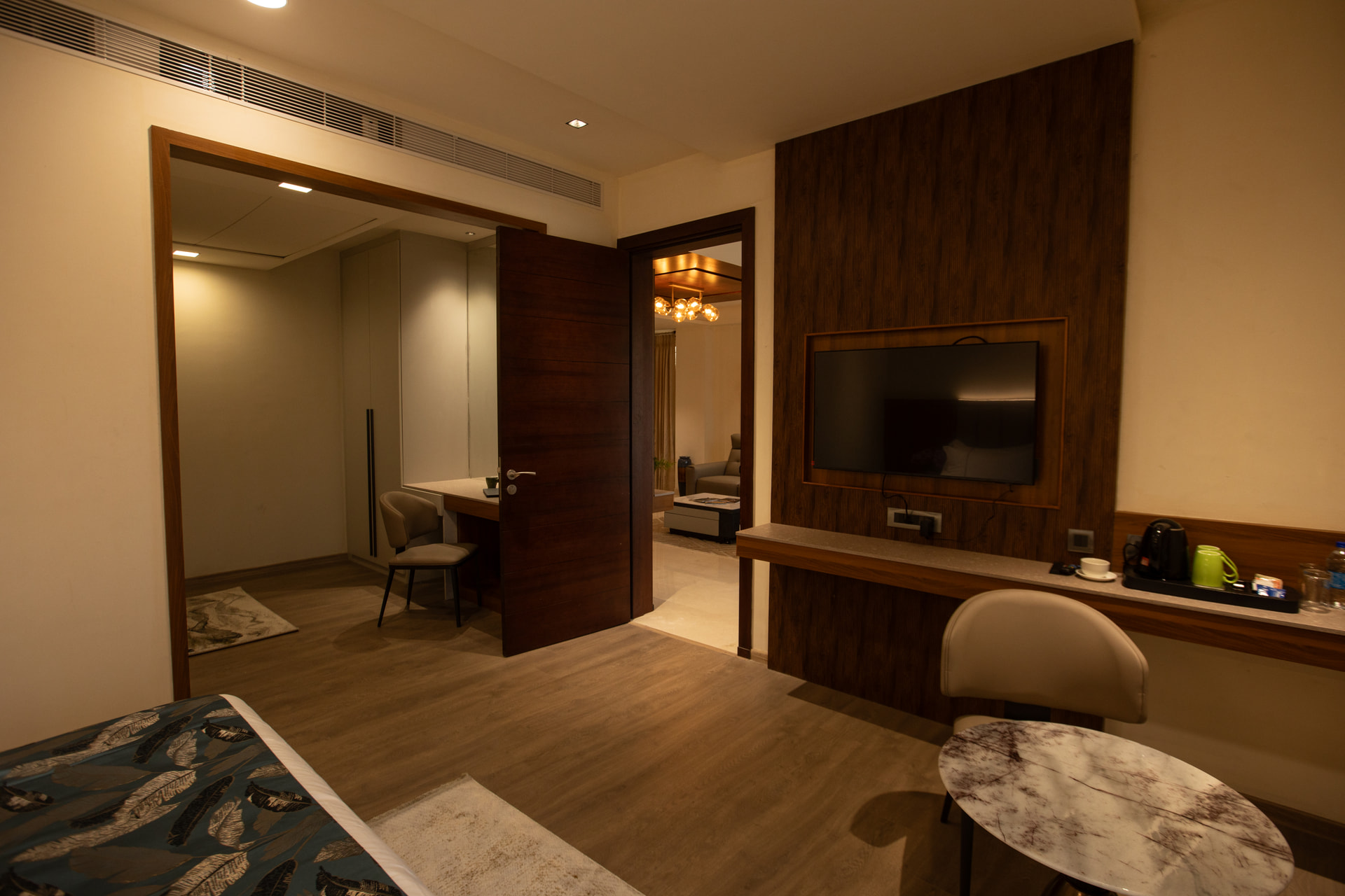 A work desk and chair in the Family Suite at Rossedale Suites & Hotel in Peelamedu, Coimbatore