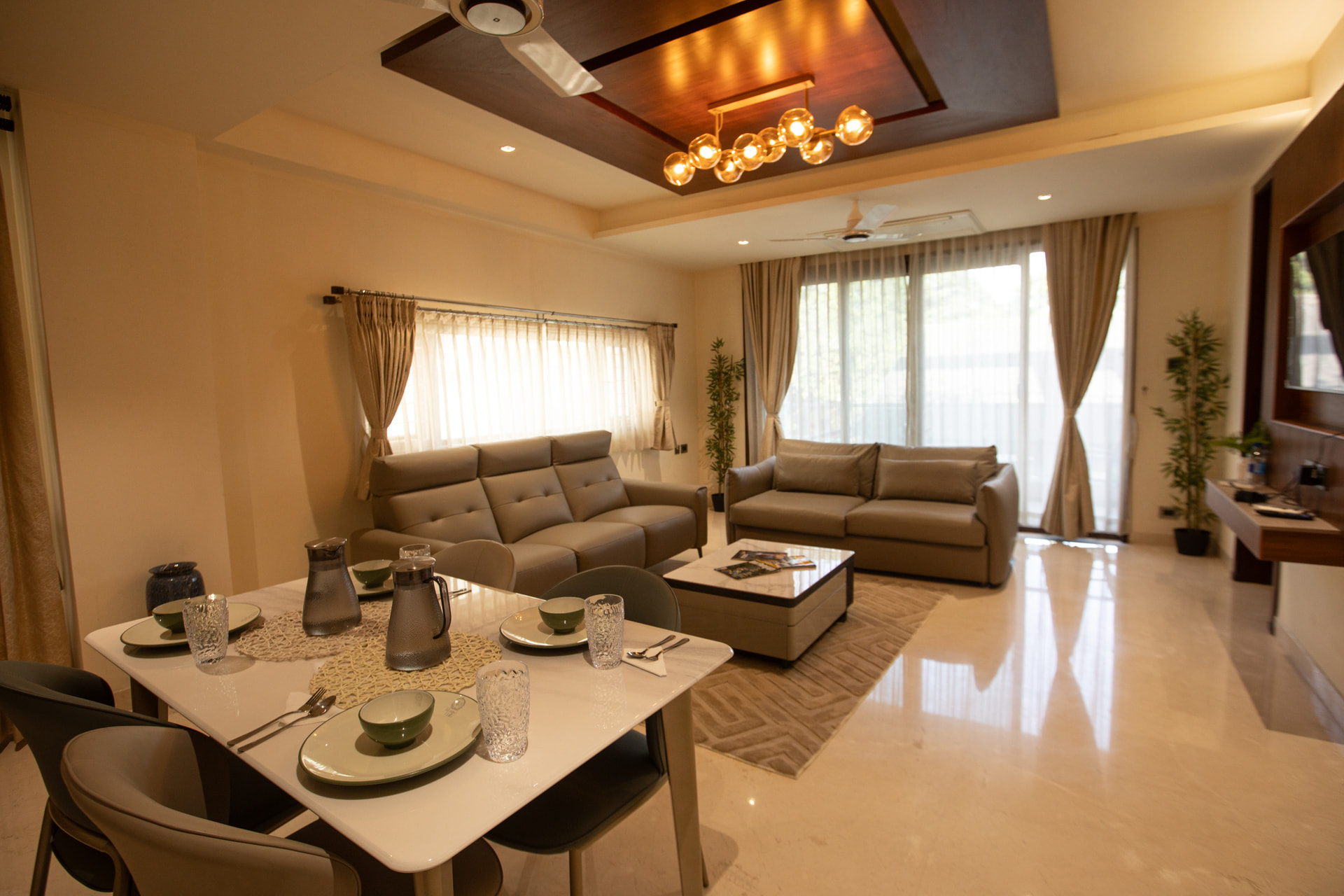 Sofa seating in the Family Suite living room at Rossedale Suites & Hotel in Peelamedu, Coimbatore