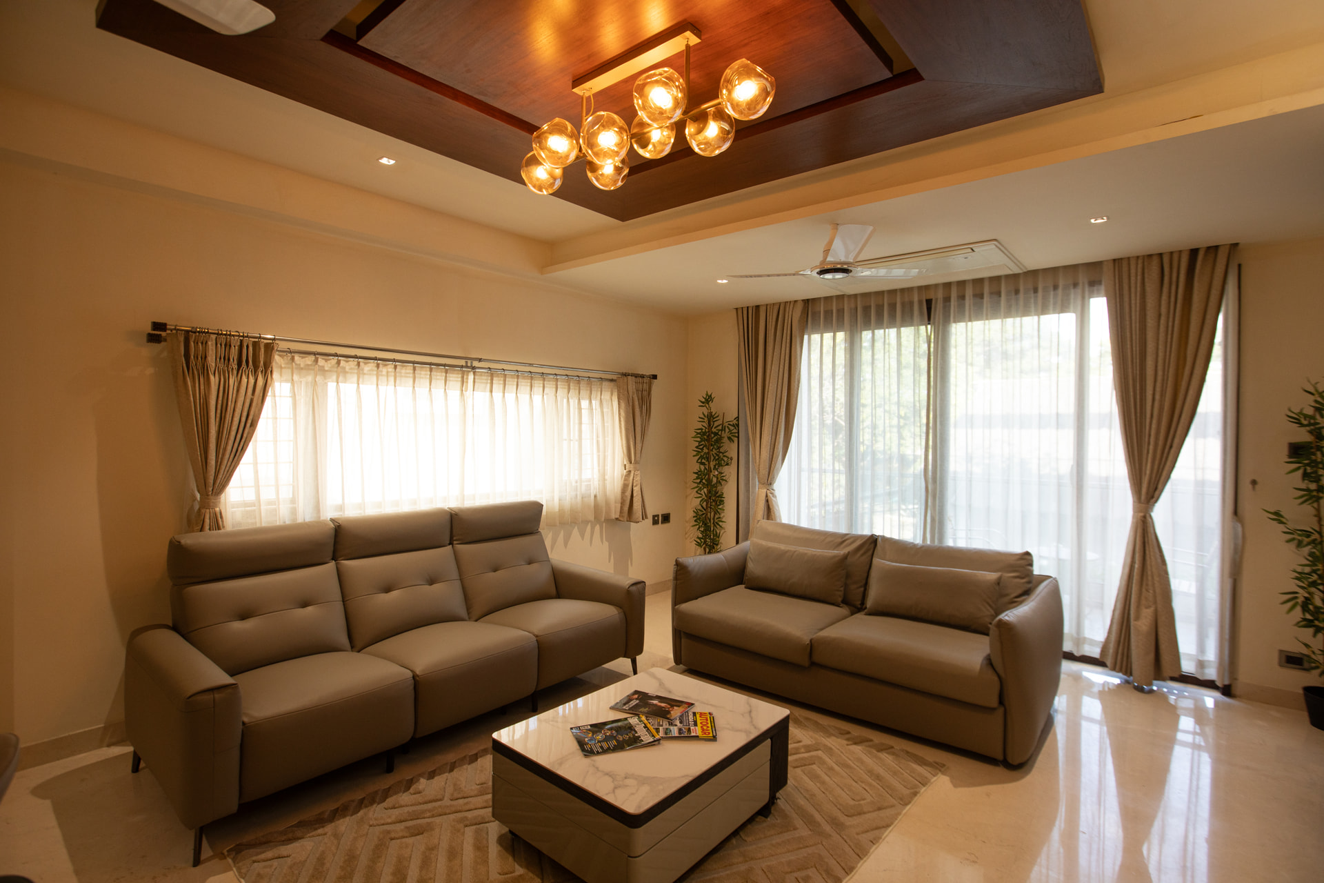 The Family Suite living area with sofa and coffee table at Rossedale Suites & Hotel in Peelamedu, Coimbatore