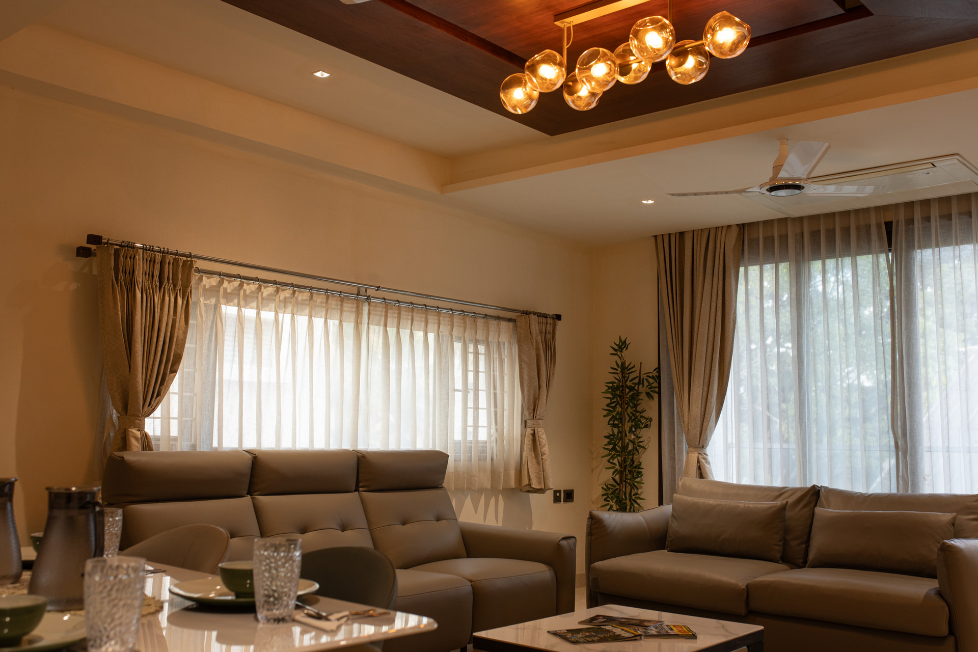 The separate living room with sofa seating in the Family Suite at Rossedale Suites & Hotel in Peelamedu, Coimbatore