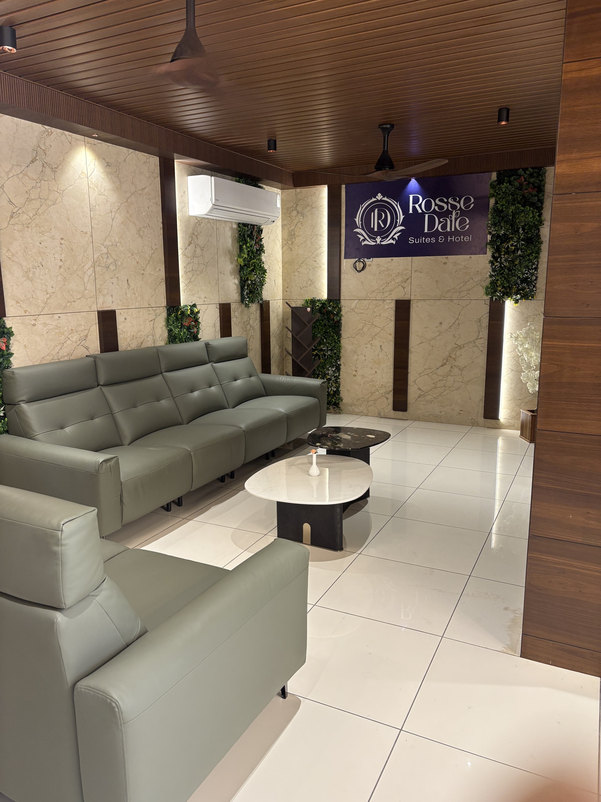 The reception lounge with Rosse Dale signage and comfortable seating where our team welcomes arriving guests at Rossedale Suites & Hotel in Peelamedu, Coimbatore