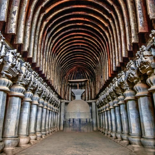 Ajanta Caves featuring an archway kind of architecture and a pathway.