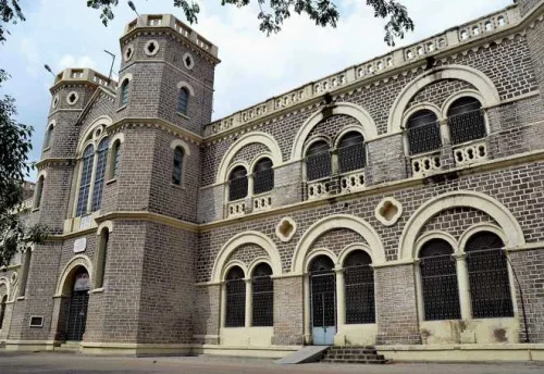 A gothic style architecture surrounded by trees.