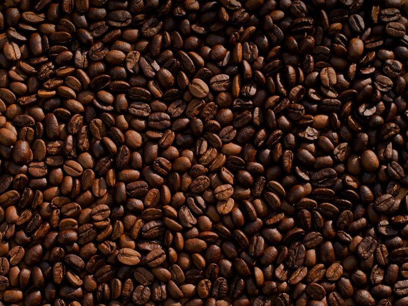 Close-up of roasted coffee beans filling the frame