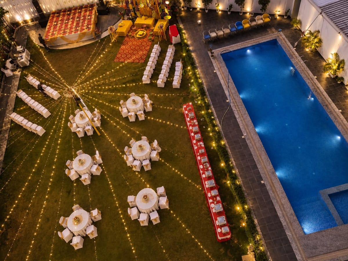 The poolside lawn set for a wedding at Crestline Shubh Vilas, Jaipur