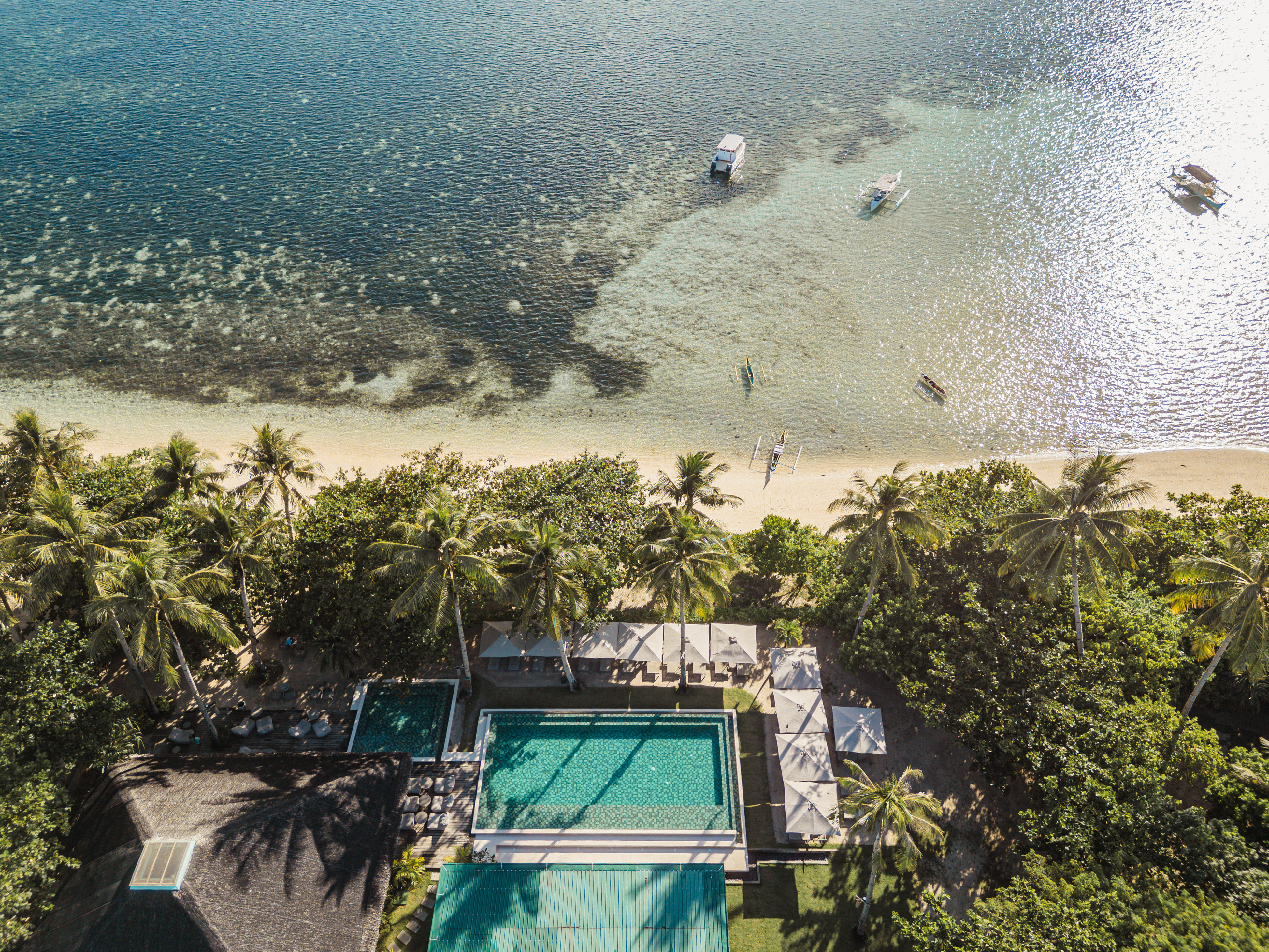 Aerial view of the beach and pool at Bravo Beach Resort Siargao