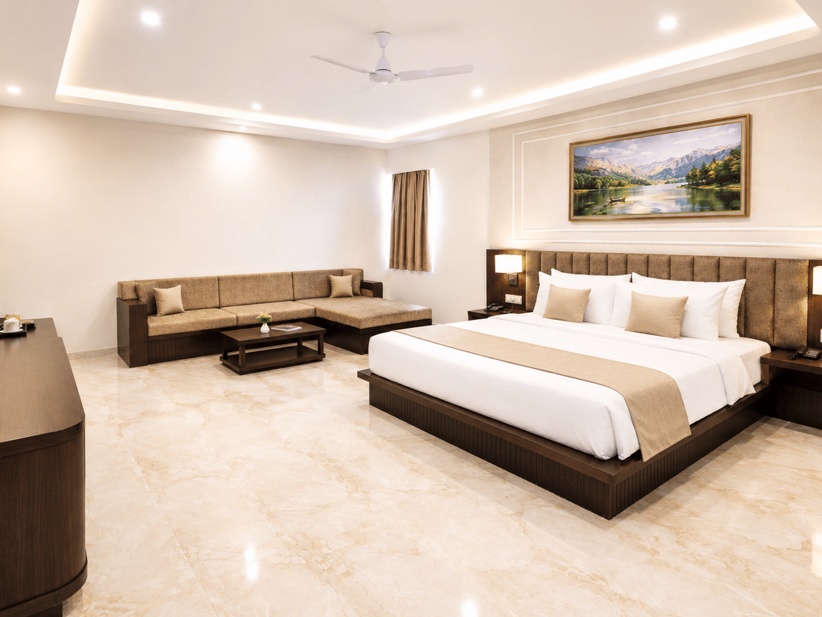Junior suite living area king bed at Signum CityScapes SKY Boutique Hotel, Indore