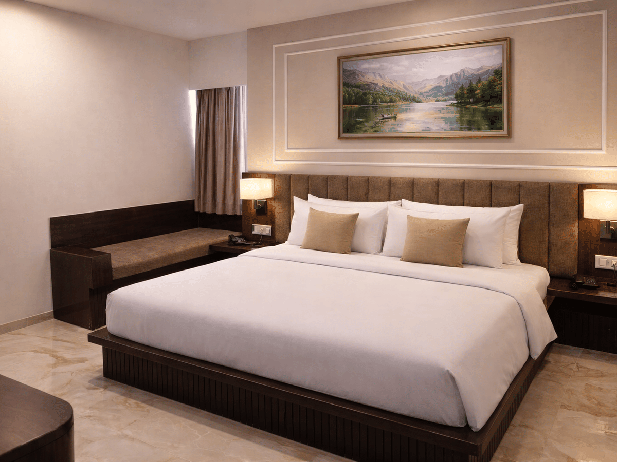 Premium room bed bench seating at Signum CityScapes SKY Boutique Hotel, Indore