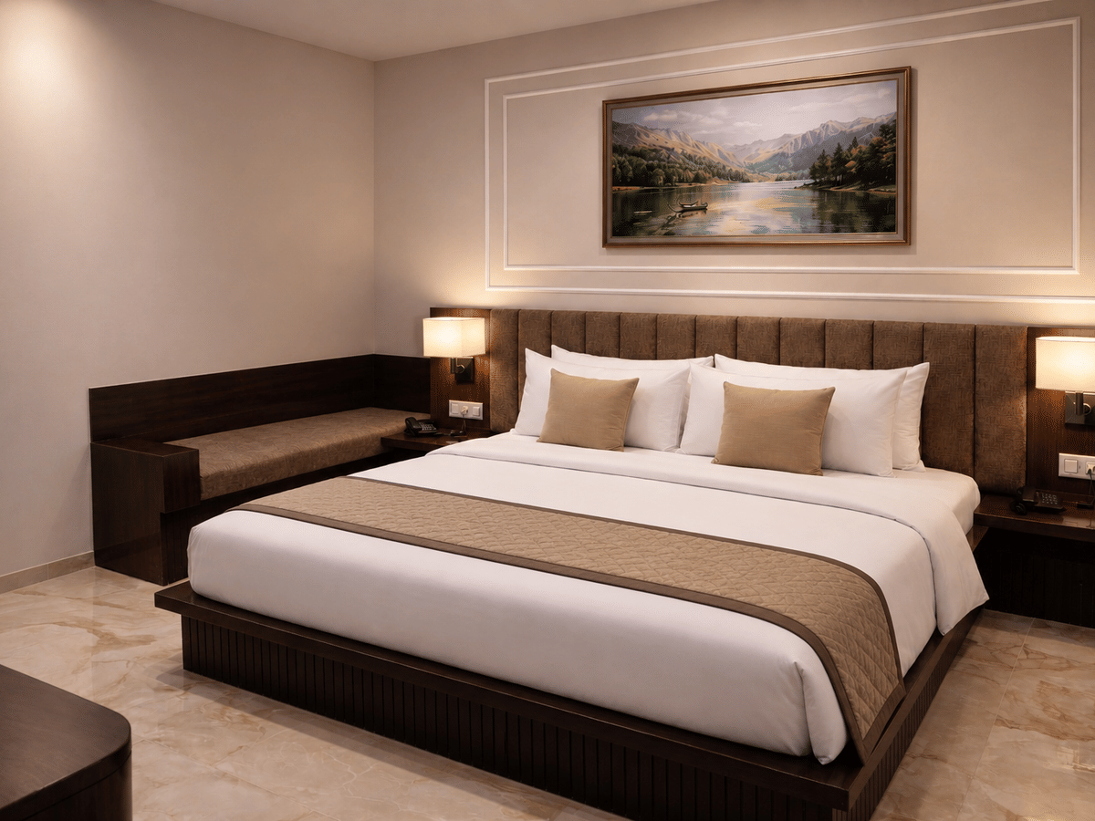 Standard room bed bench seating at Signum CityScapes SKY Boutique Hotel, Indore