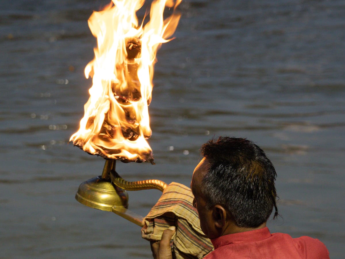 A priest performing the evening Ganga Aarti on the ghats at Haridwar