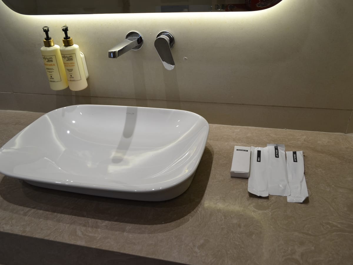 The bathroom sink in a guest room at Signum Tathastu Boutique Hotel, Haridwar