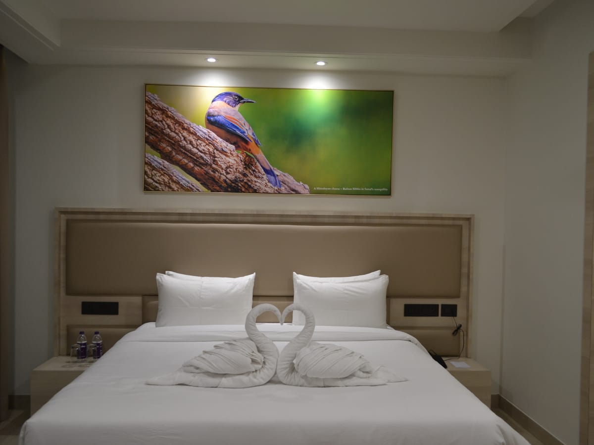 The bed in a Deluxe Double Room at Signum Tathastu Boutique Hotel, Haridwar