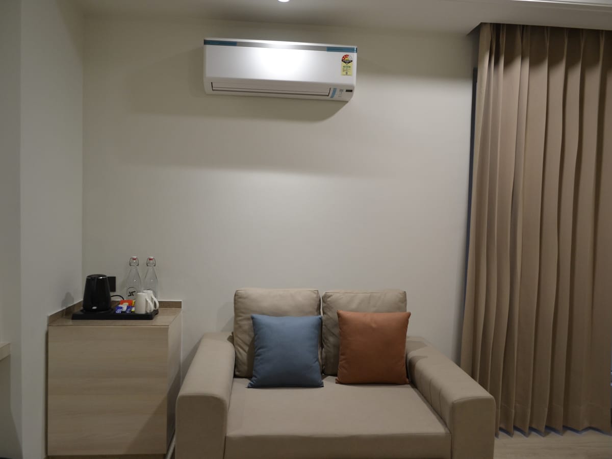 The seating area in a Deluxe Double Room at Signum Tathastu Boutique Hotel, Haridwar