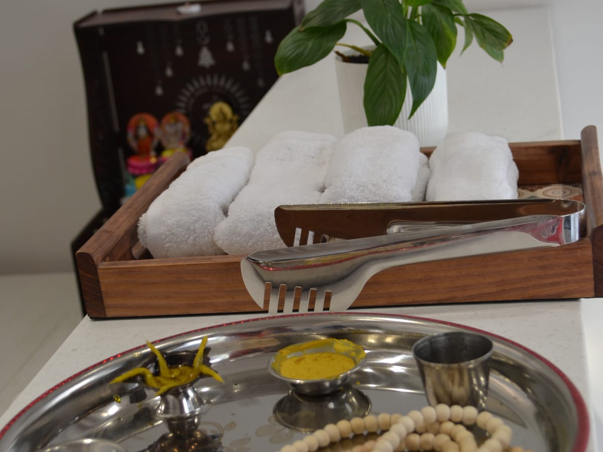 Guest essentials laid out on the lobby desk at Signum Tathastu Boutique Hotel, Haridwar