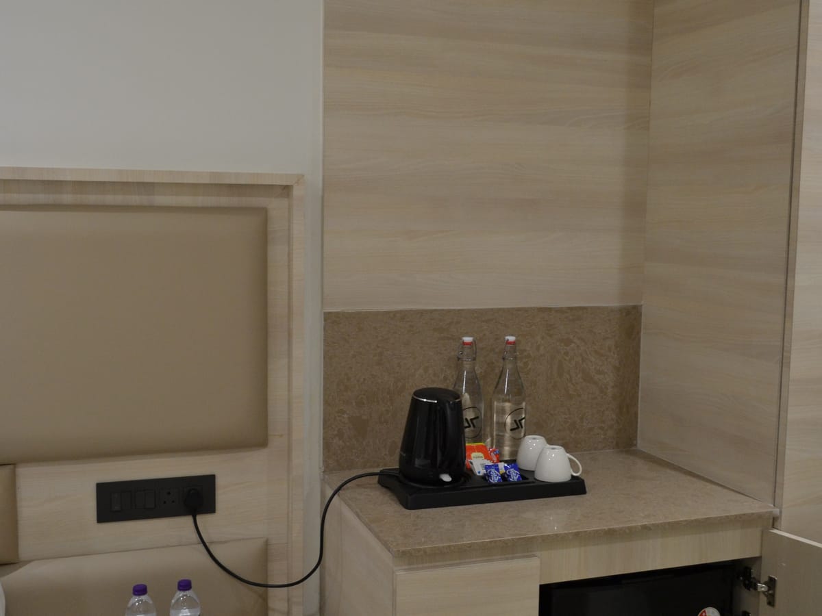 Amenities set out in a guest room at Signum Tathastu Boutique Hotel, Haridwar