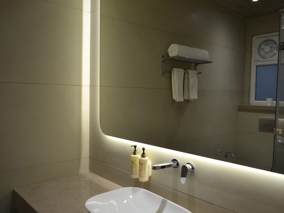 The bathroom vanity in a guest room at Signum Tathastu Boutique Hotel, Haridwar
