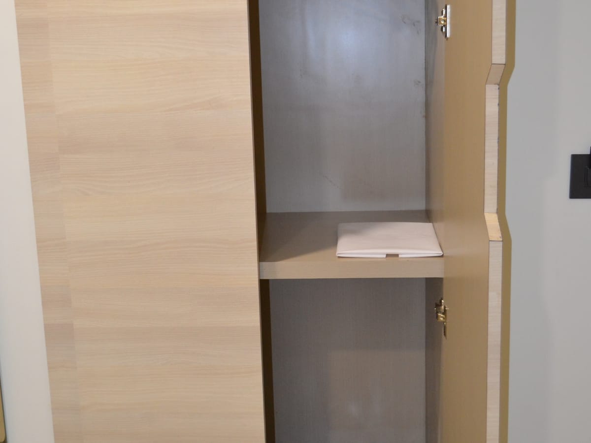 The in-room wardrobe at Signum Tathastu Boutique Hotel, Haridwar