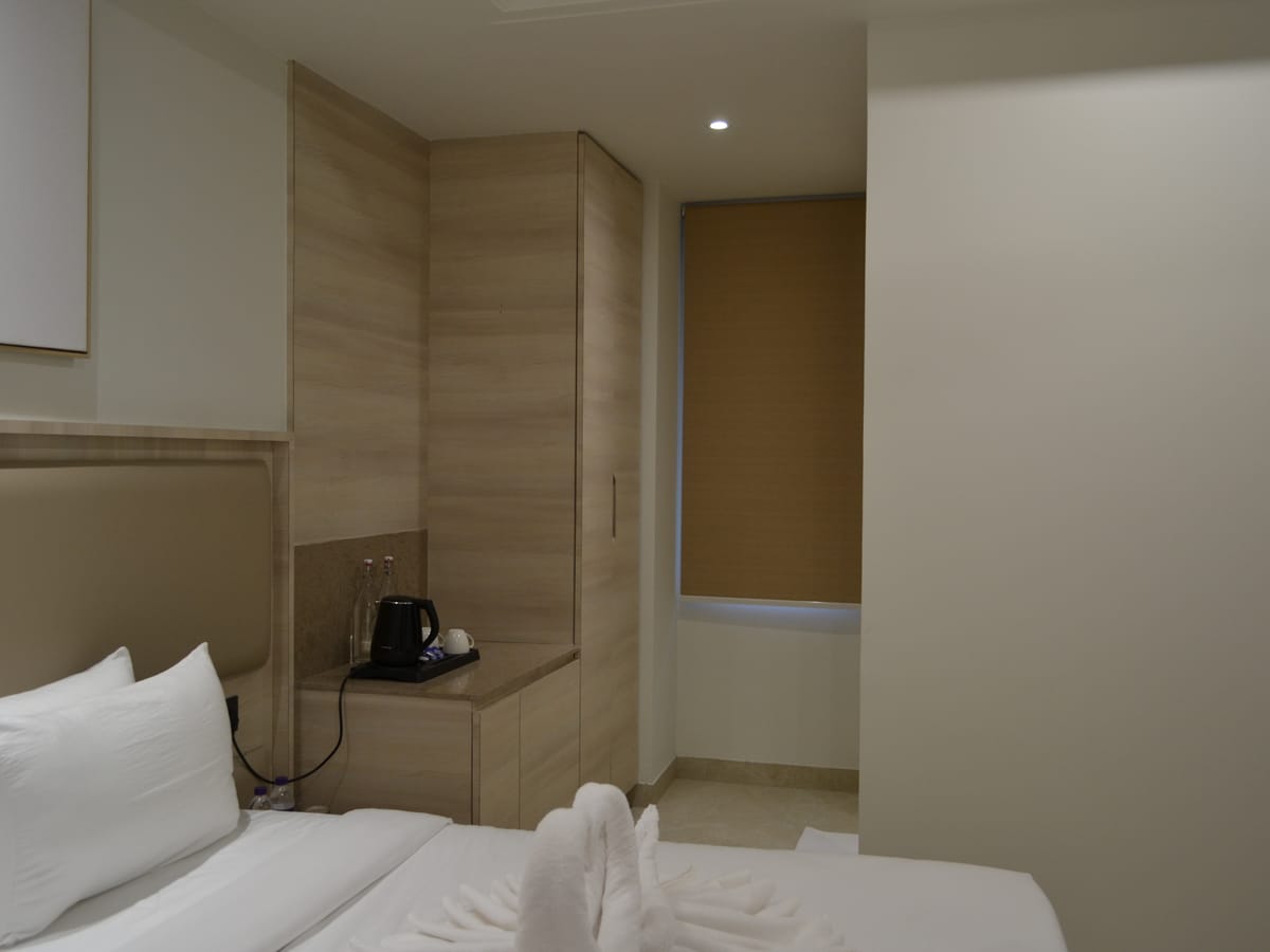 A Standard Double Room seen from the doorway at Signum Tathastu Boutique Hotel, Haridwar