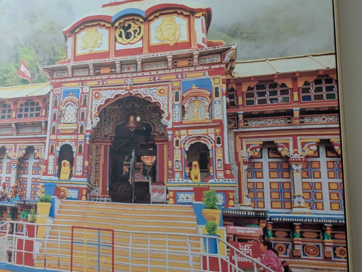 A painted temple panel on the wall at Signum Tathastu Boutique Hotel, Haridwar