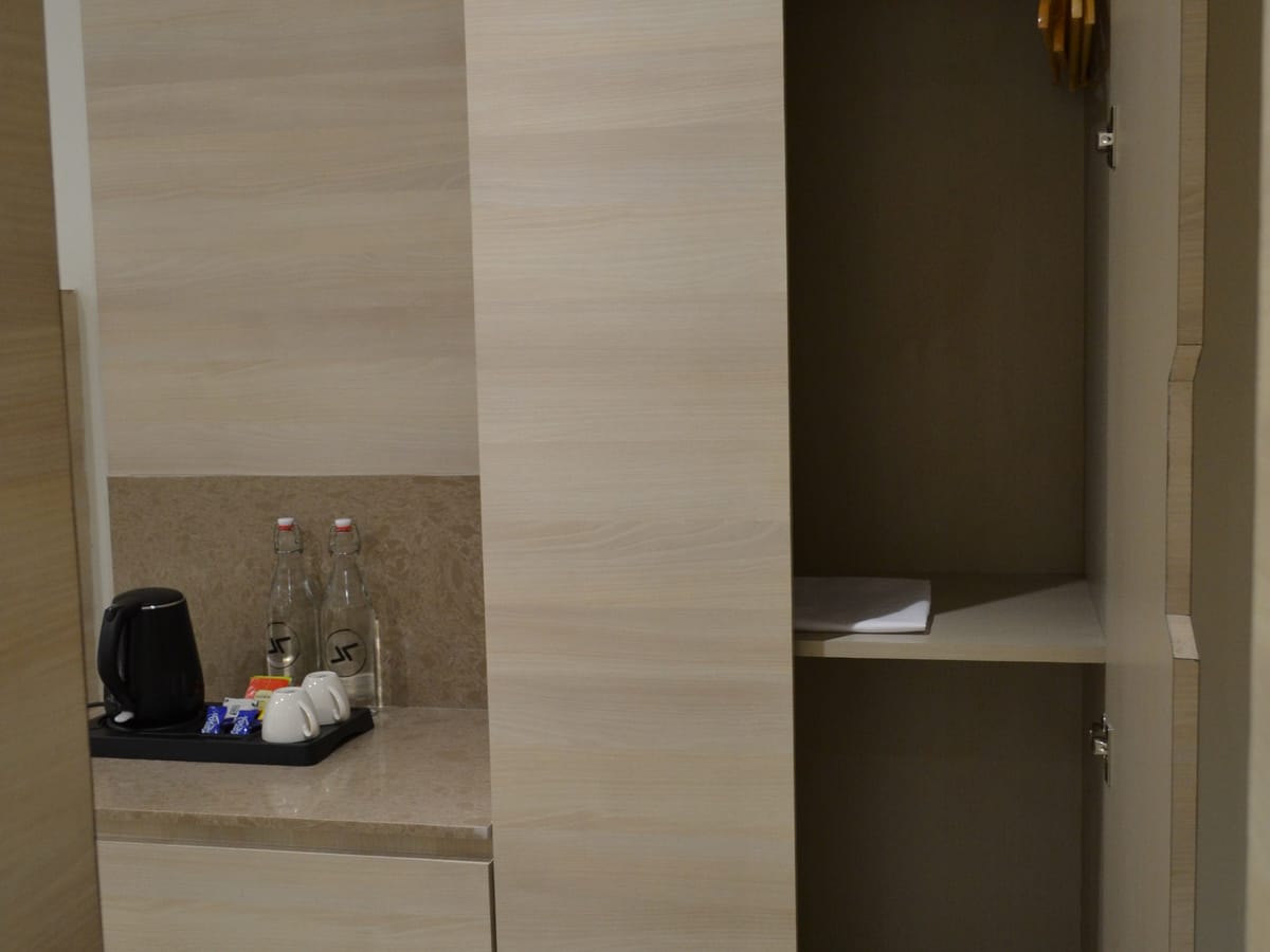 Hanging space in a guest room at Signum Tathastu Boutique Hotel, Haridwar