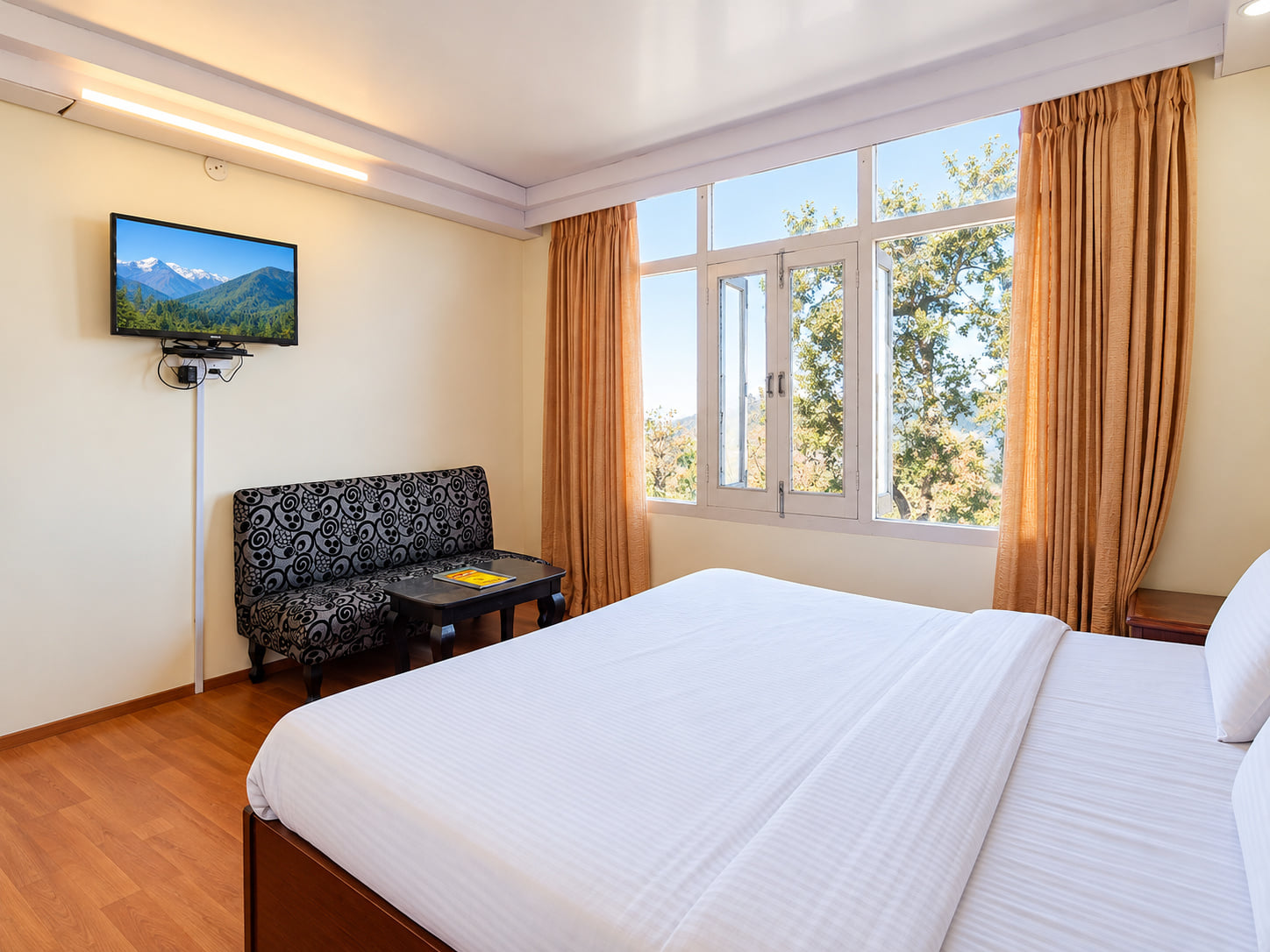 Standard Room and its TV, Hotel Surya Resort