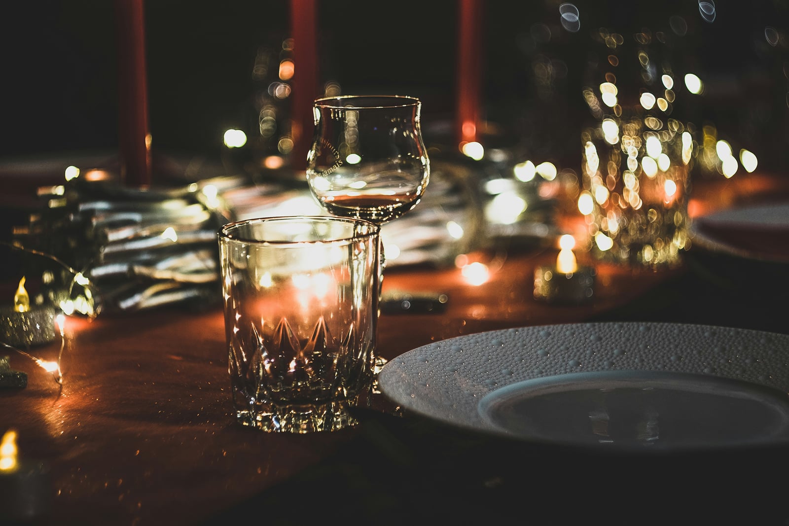 A candlelit table set for dinner