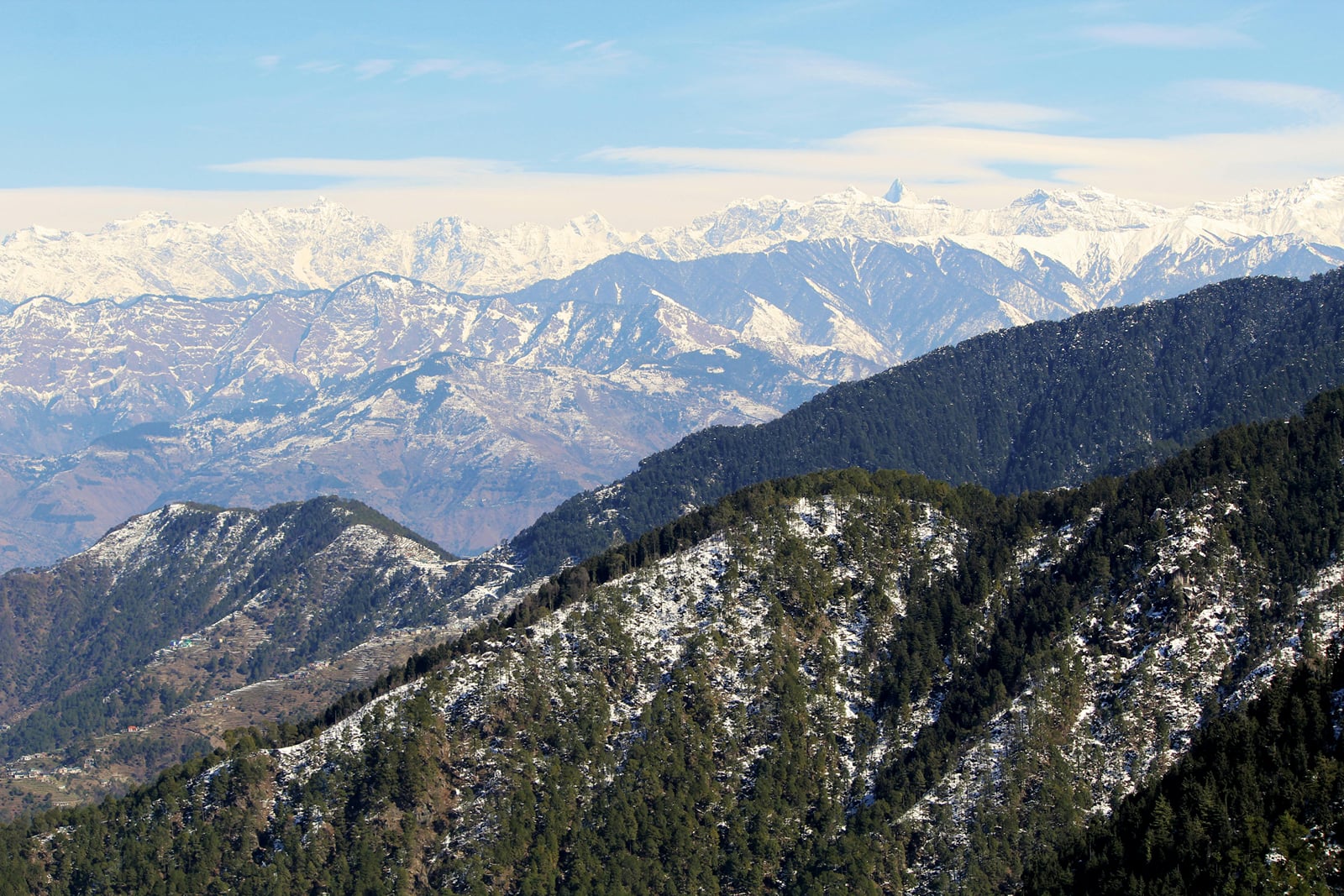 Snow-dusted ridges leading to the high Himalaya