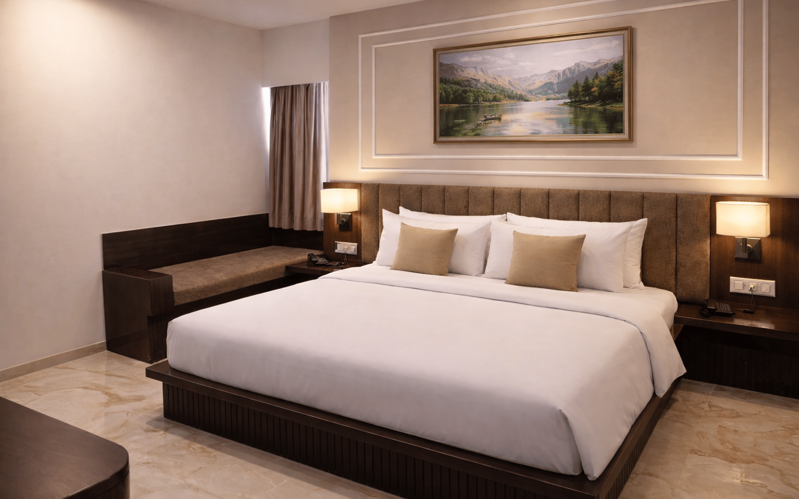 Bed and bench seating in a Premium Room at Signum CityScapes SKY Boutique Hotel, Indore
