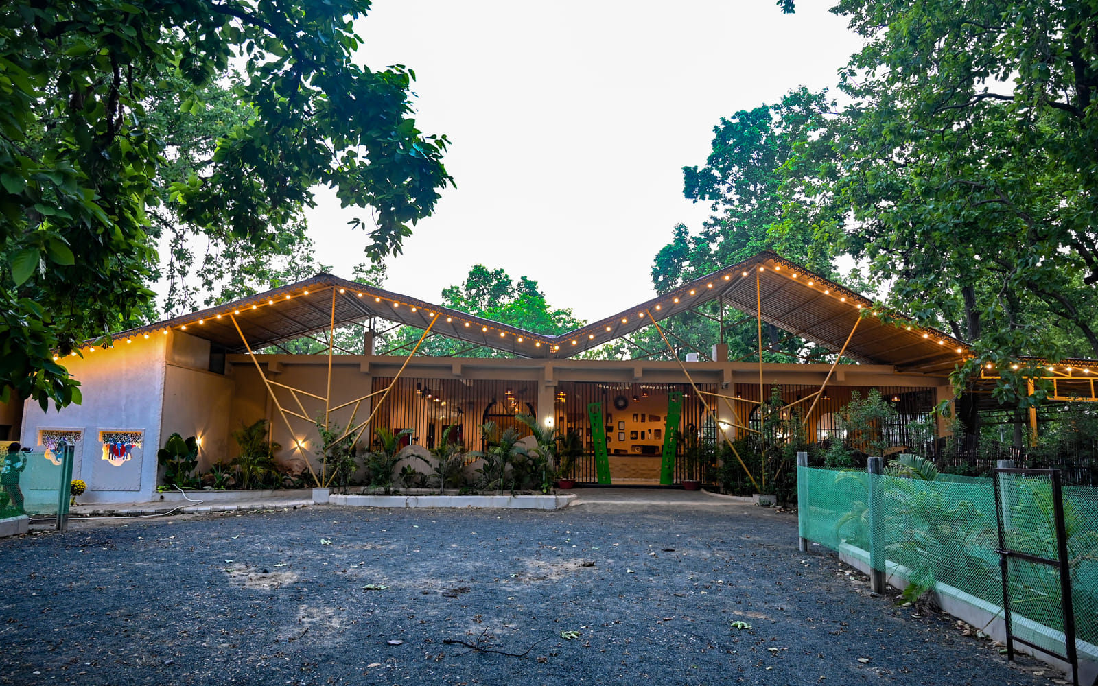 An outdoor pavilion strung with lights in the evening