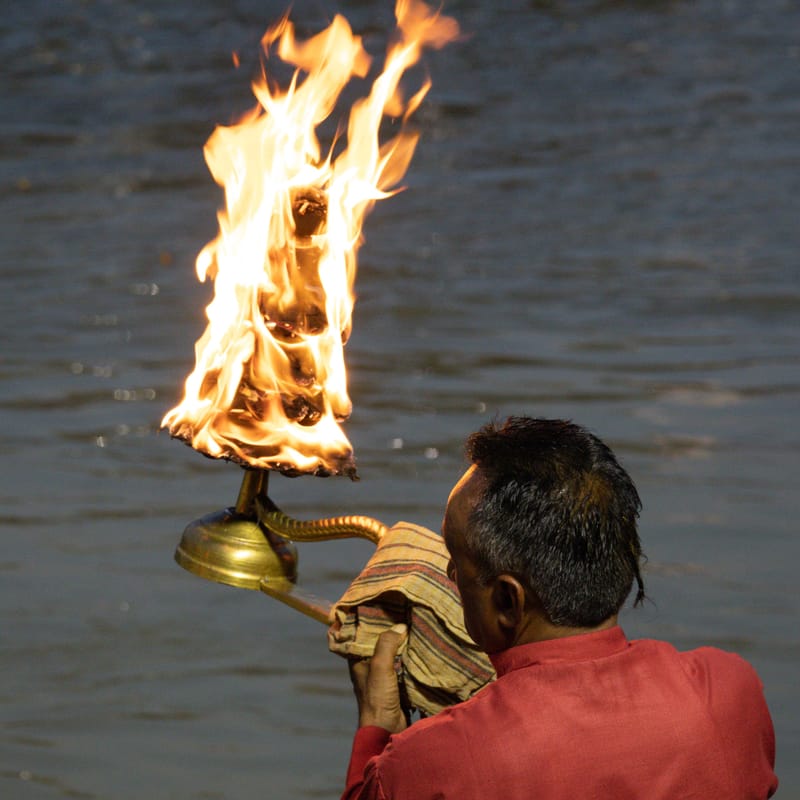A priest performing the evening Ganga Aarti on the ghats at Haridwar