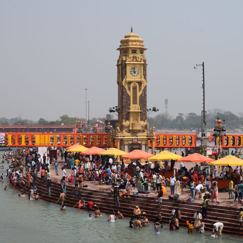 Pilgrims on the steps at Har Ki Pauri, Haridwar, below the clock tower