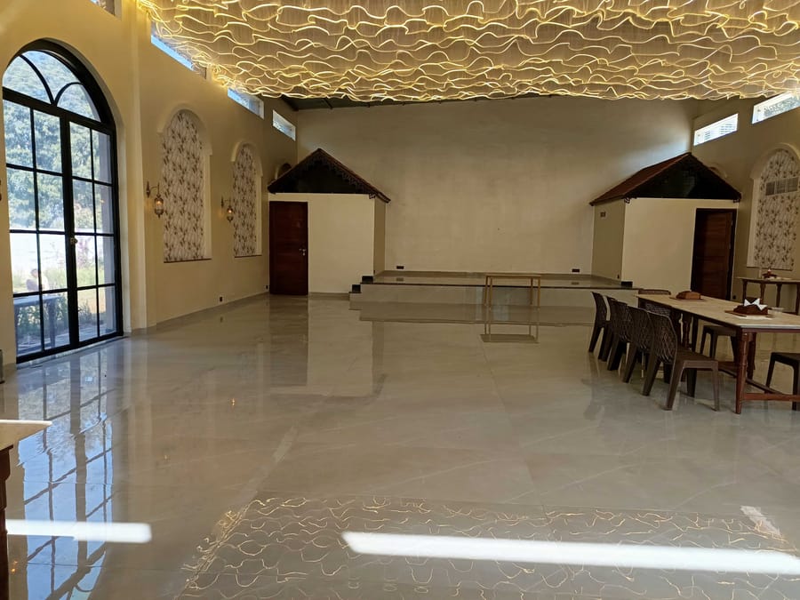 The banquet hall set with a long table at Signum Resort, Bandhavgarh