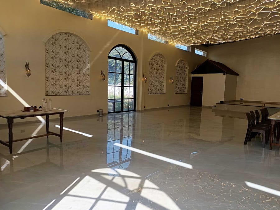 Daylight through the banquet&rsquo;s arched windows at Signum Resort, Bandhavgarh
