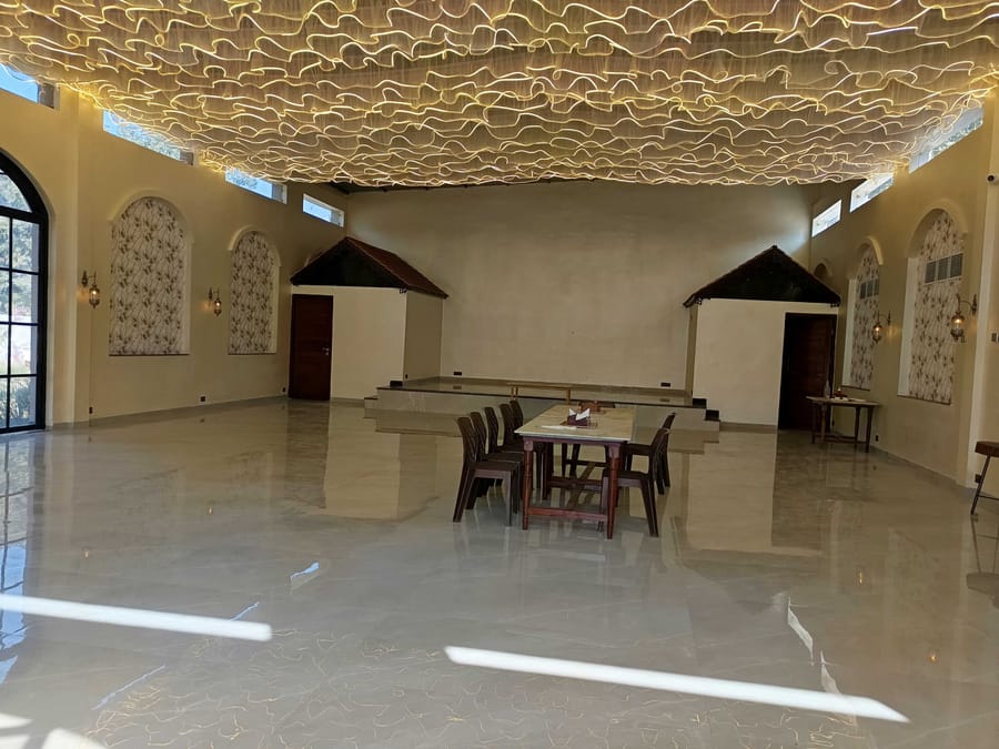 The Signum Banquet laid out under its lit ceiling at Signum Resort, Bandhavgarh