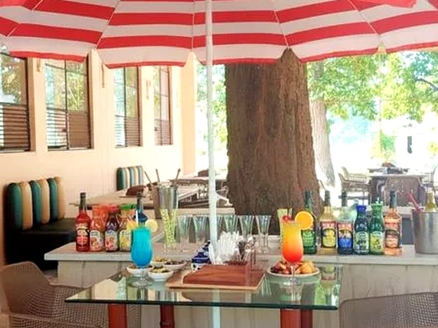 Drinks laid out on a table beneath the trees at Signum Resort, Bandhavgarh