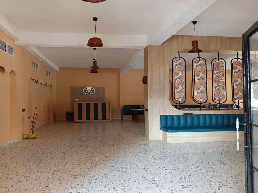 The buffet counter and lounge seating at Signum Resort, Bandhavgarh