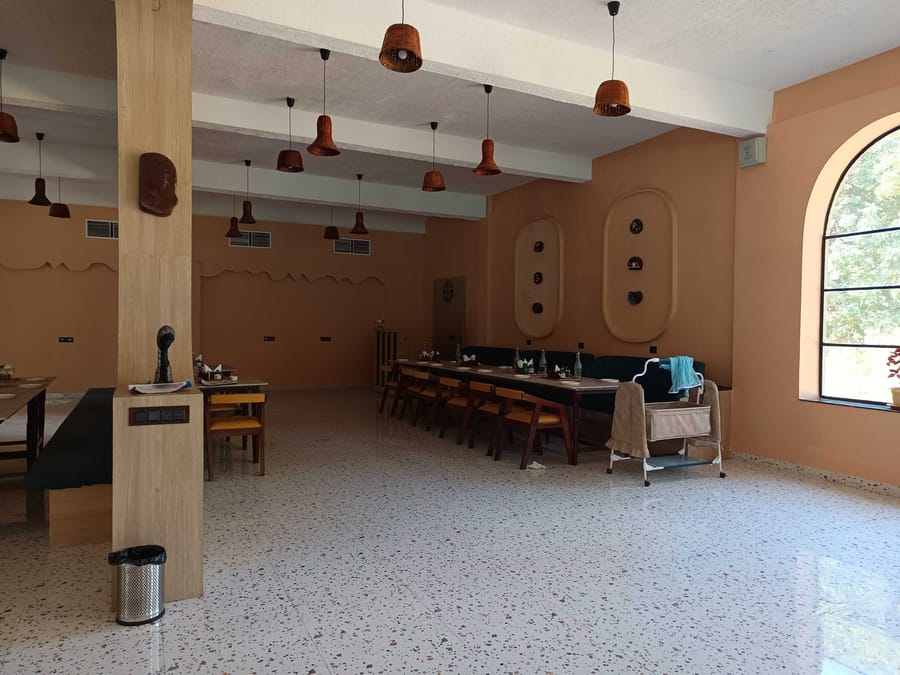 Outdoor restaurant seating at Signum Resort, Bandhavgarh