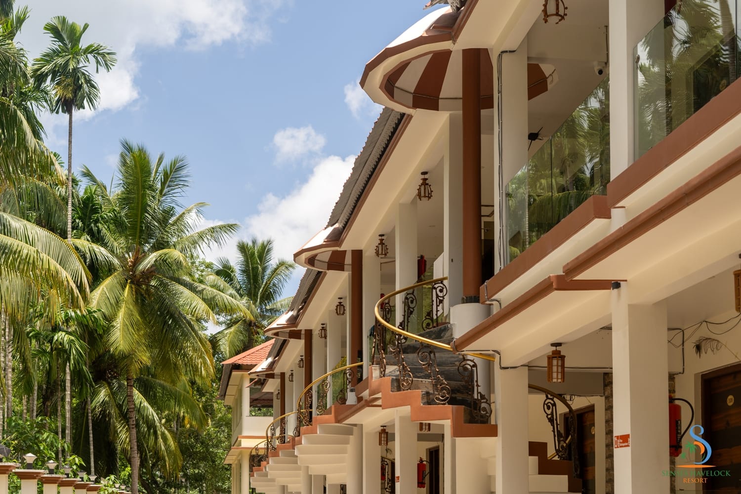 Duplex room blocks with spiral staircases among the coconut groves at Senses Havelock Resort