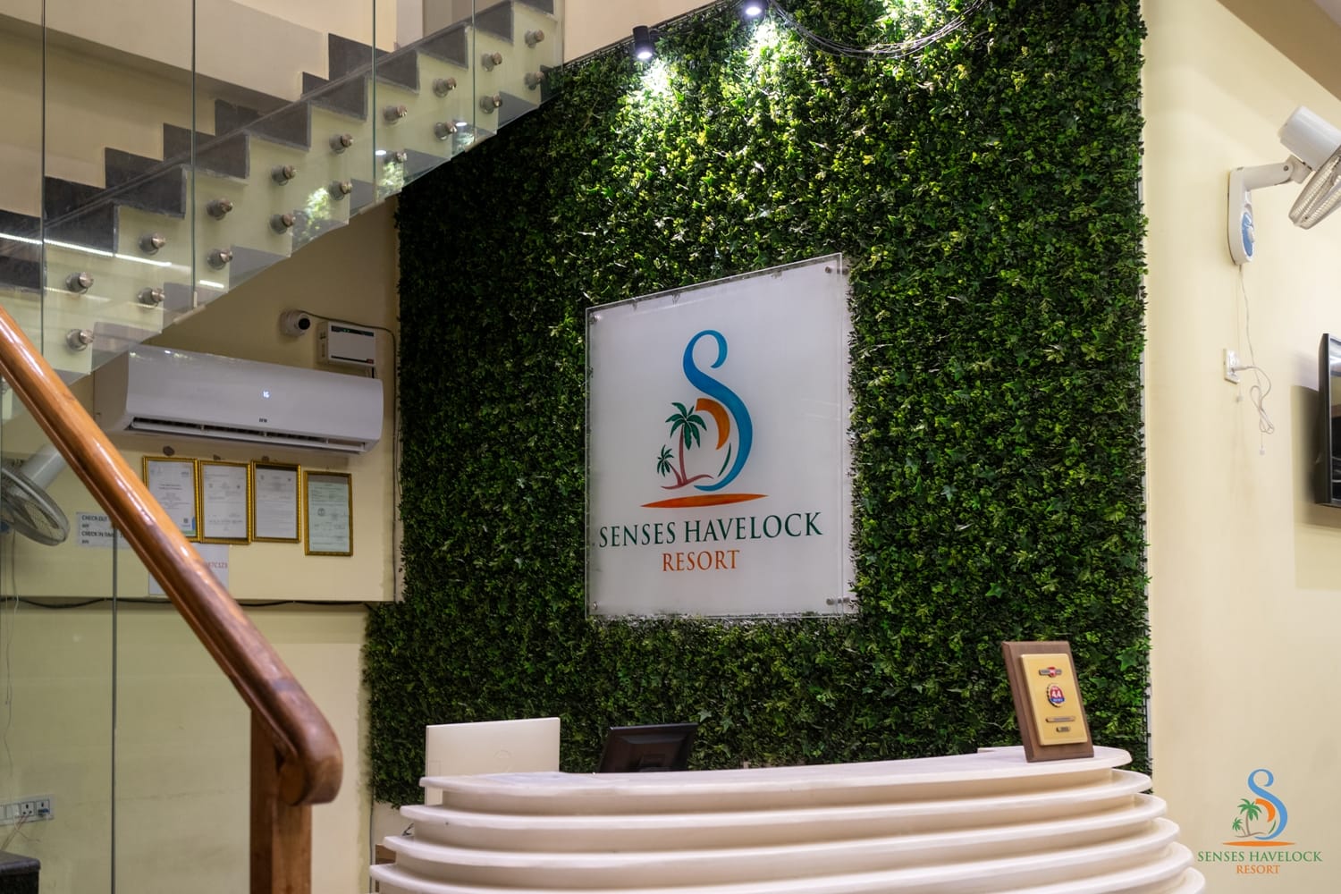 The resort reception, with a living green wall behind the desk