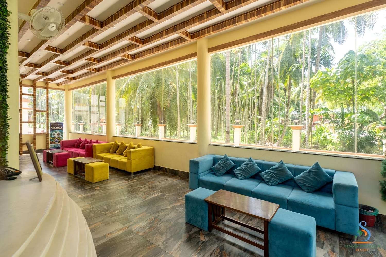 Lounge sofas beside the lobby's glazed wall