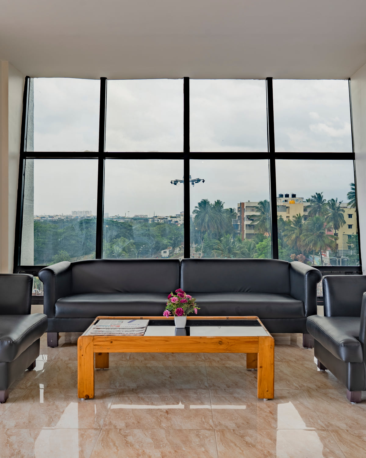 Lounge seating by the floor-to-ceiling windows