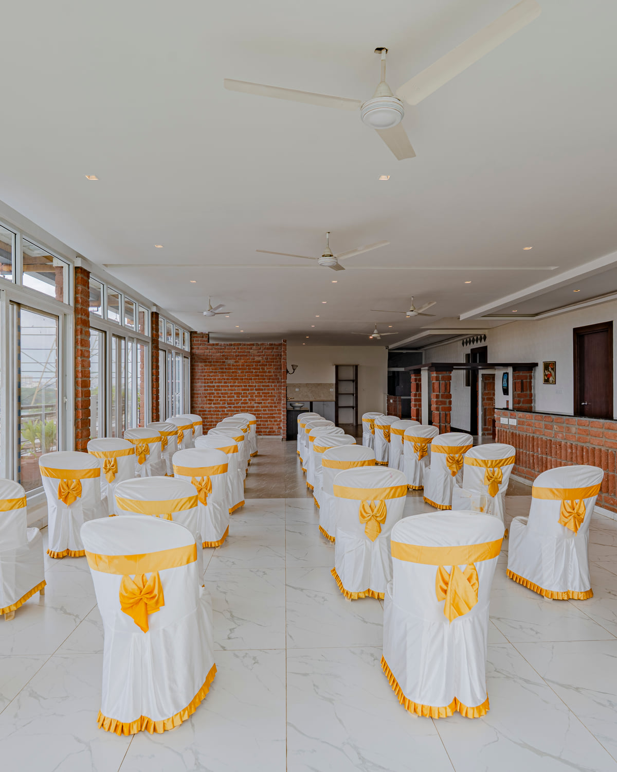 The terrace banquet hall with brick columns and a bar counter