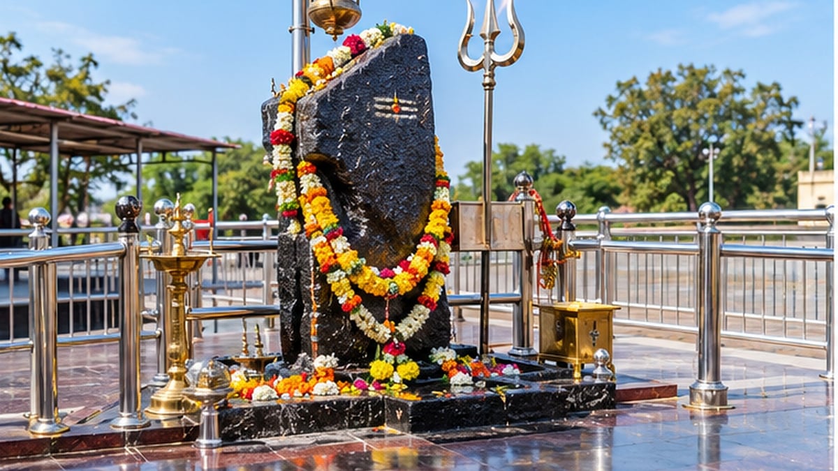 Garlanded Shani Dev shrine under the open sky at Shani Shingnapur
